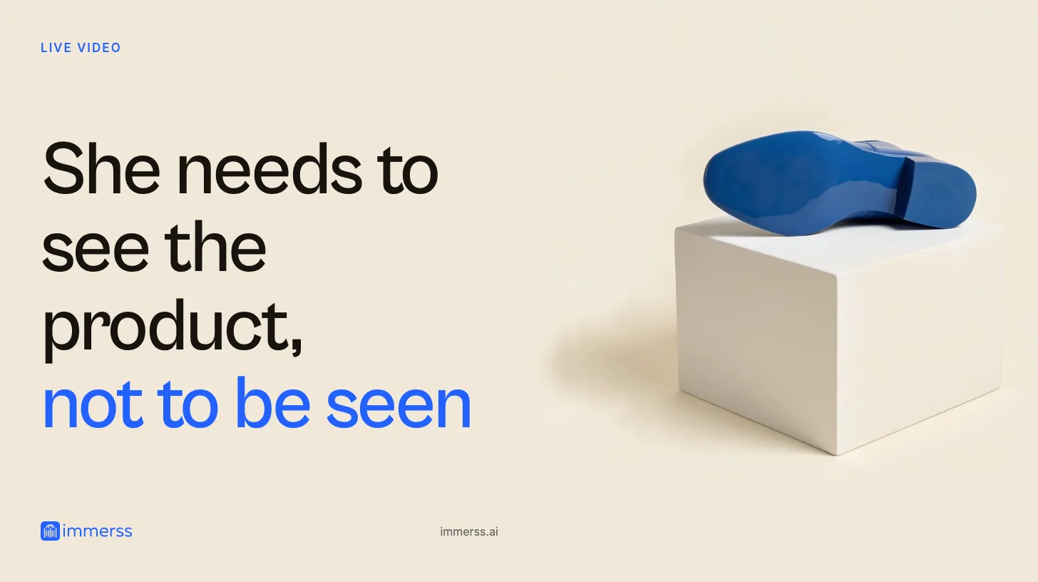 She needs to see the product, not to be seen. An ankle boot lying on its side on a low display cube, the whole underside of its sole turned to the viewer